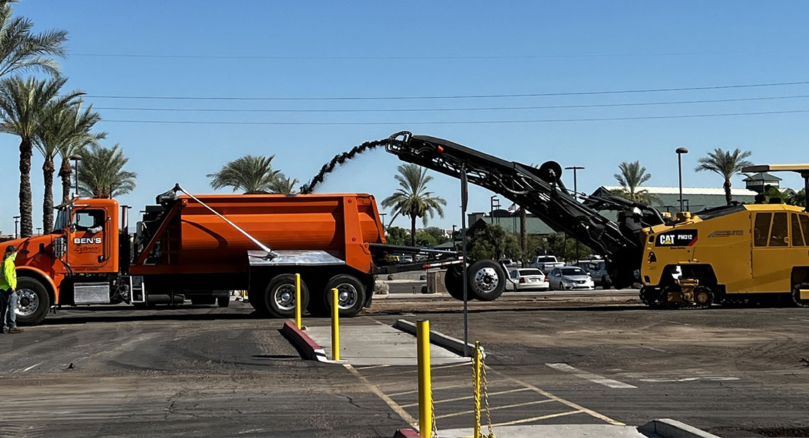 asphalt millings going into bed of truck