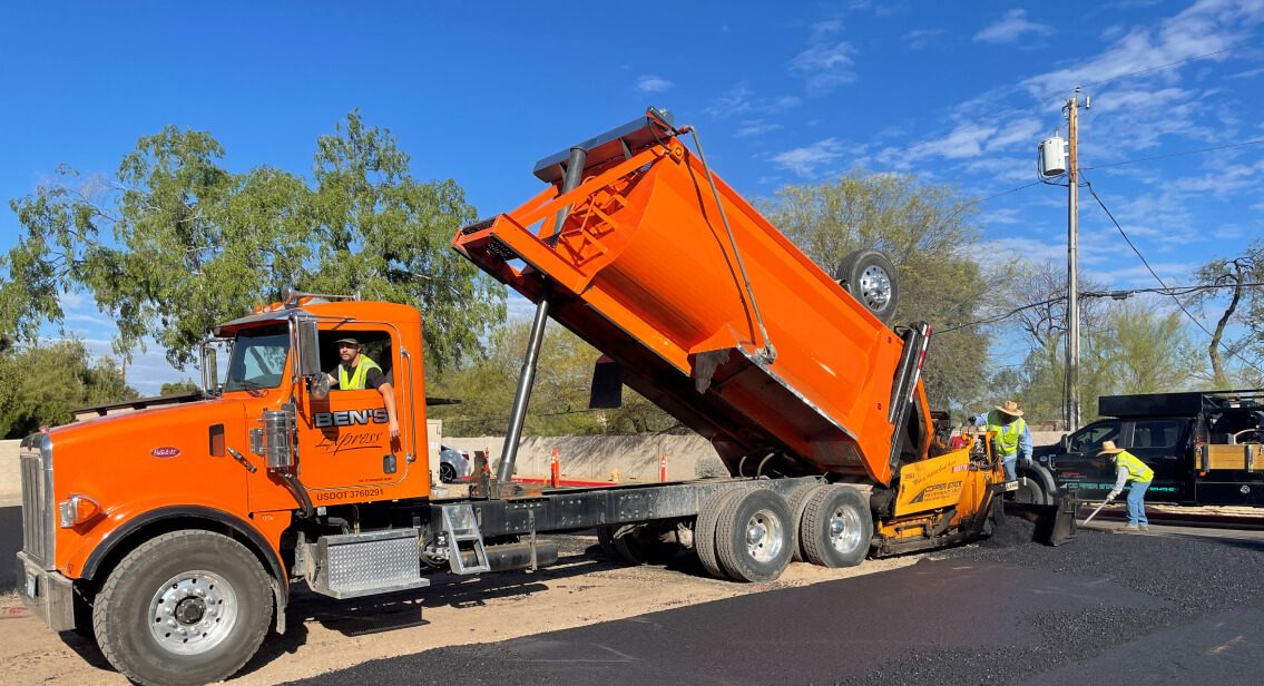 ben's express dump truck pouring asphalt