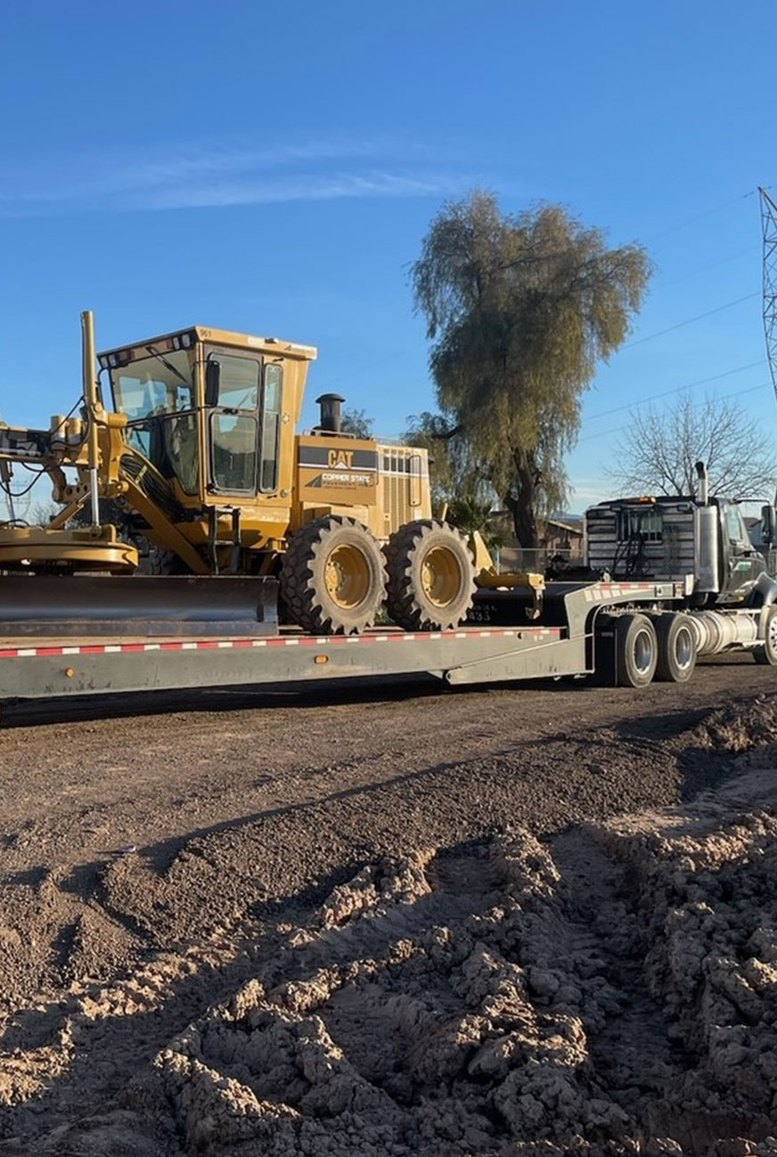 semi hauling equipment on a trailer