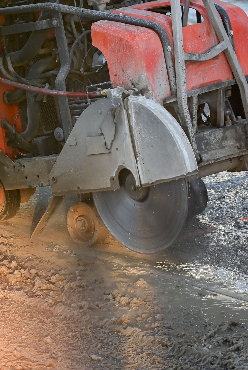 close-up of saw cutting concrete