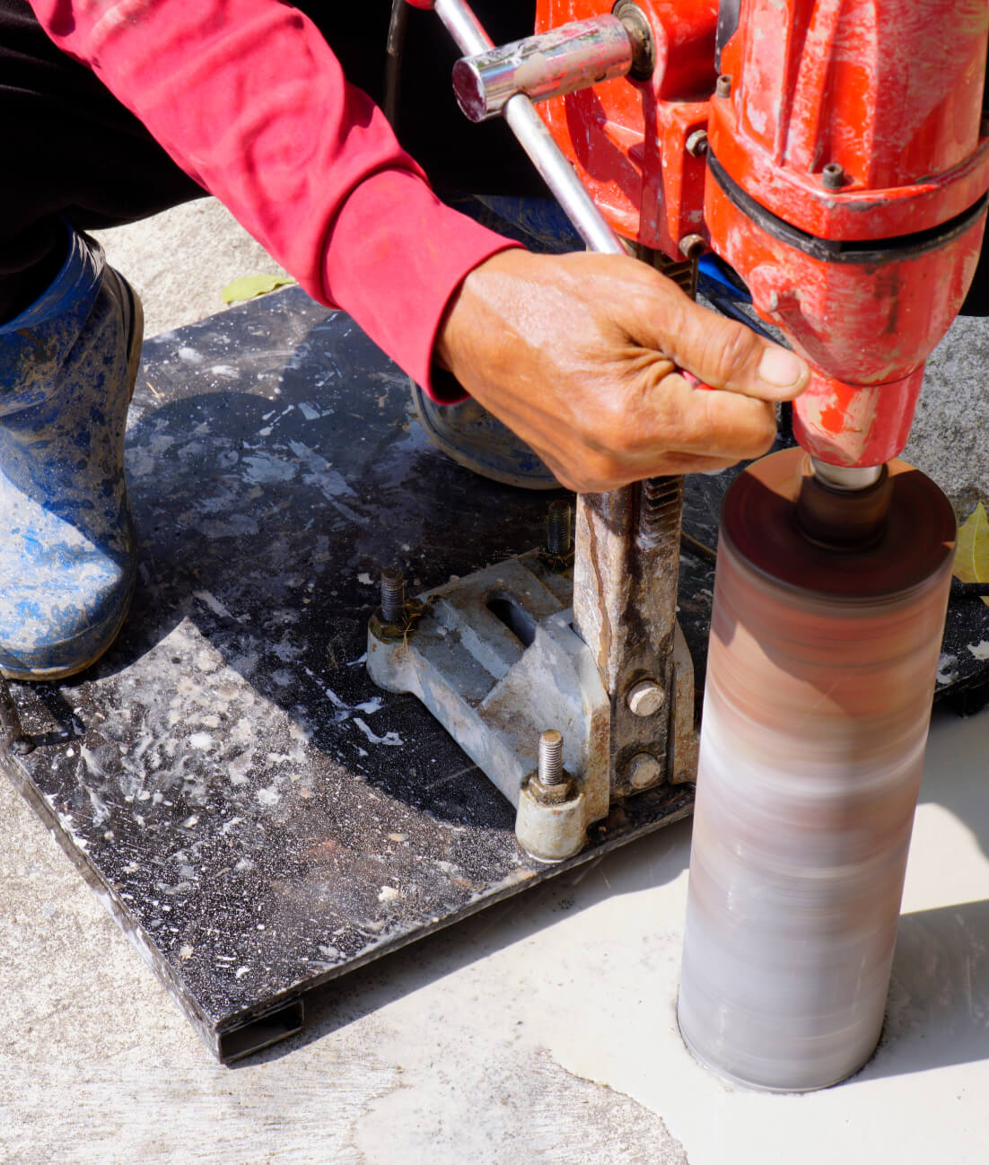 close-up of gentleman coring concrete